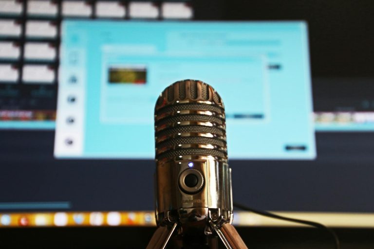 selective focus photography of gray stainless steel condenser microphone start a podcast