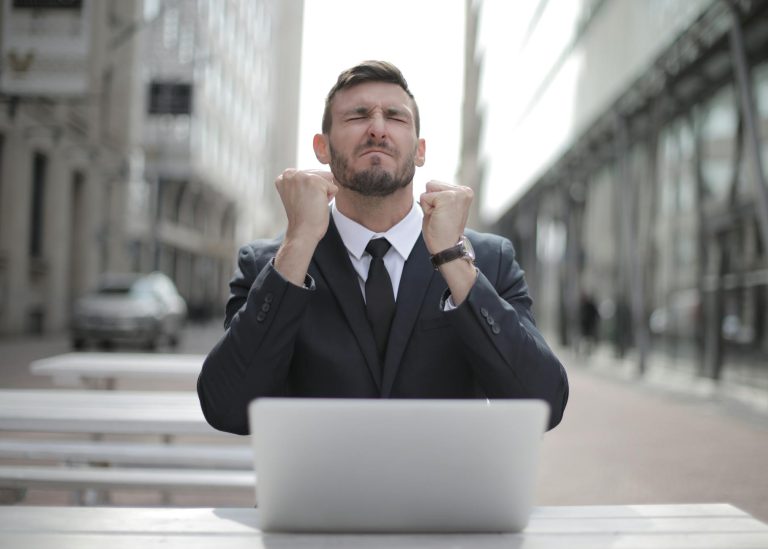 man in black suit sitting on chair beside buildings how to make 35 dollars fast