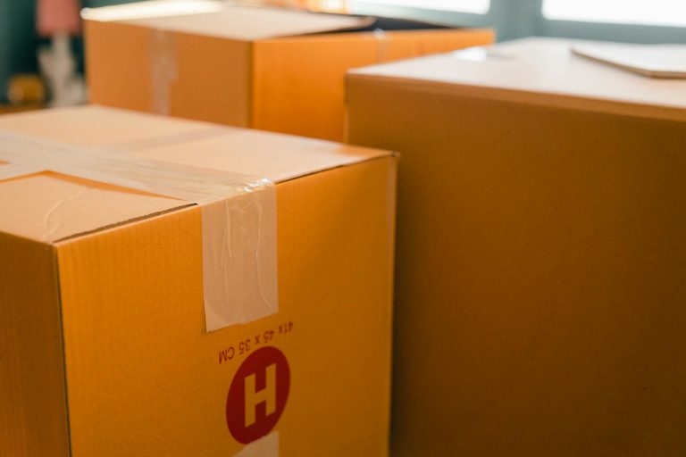 carton boxes near window in sunny room reselling on amazon