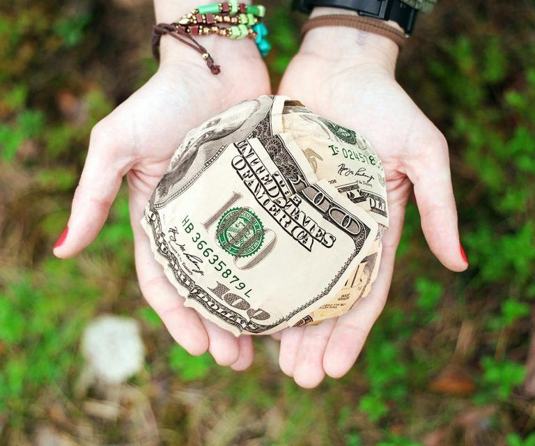 person holding u s dollar banknotes how to make money